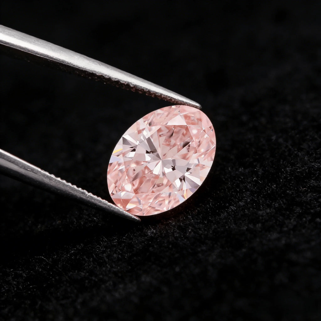 Oval fancy pink lab-grown diamond from side angle, crisp facet reflections