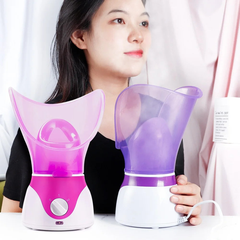 Woman using portable pink and purple electric facial steamers for skin moisturizing and deep pore cleaning at home.