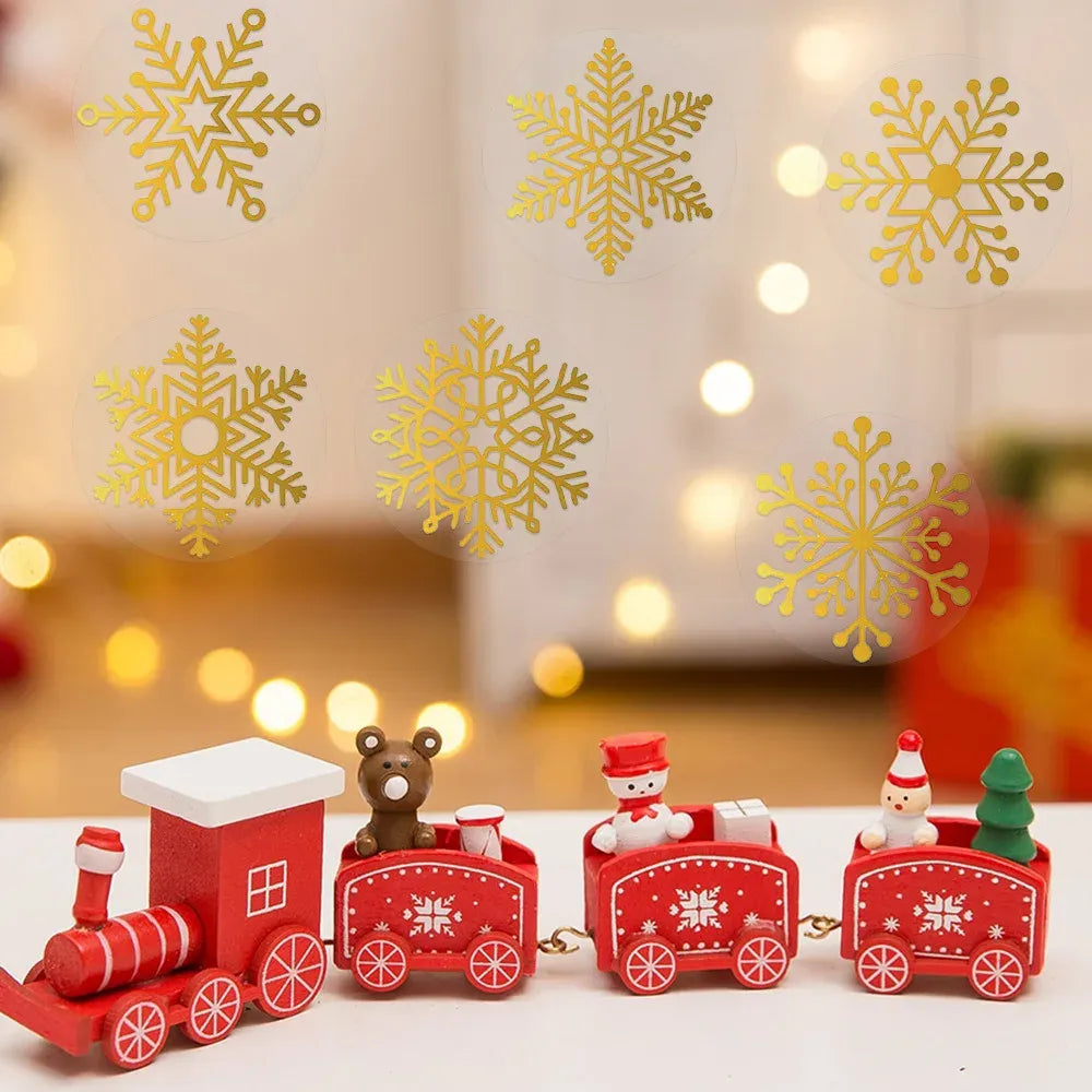 Gold foil snowflake circle stickers on transparent window film