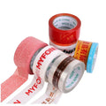 Printed adhesive sealing tape rolls in red, white, pink, and blue close-up