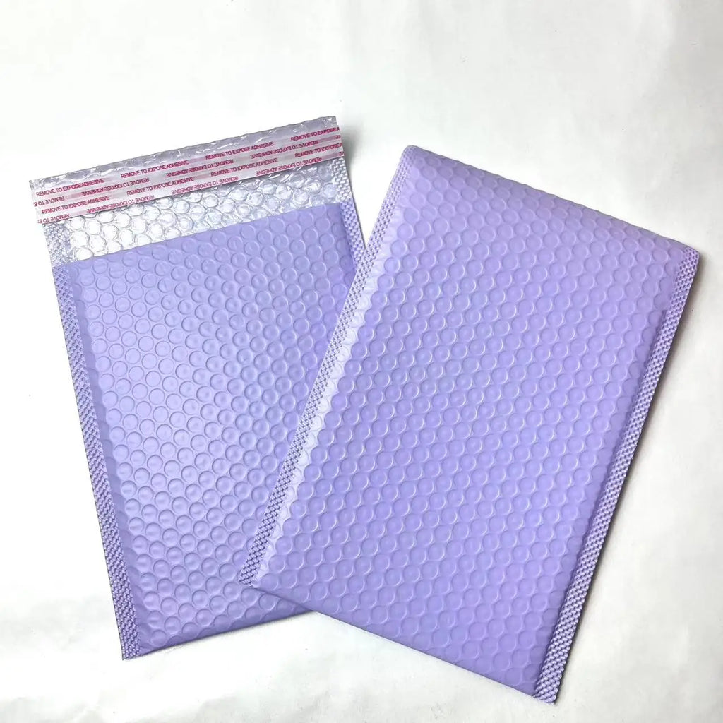 Lilac bubble mailer shipping bags with raised bubble-texture poly surface.