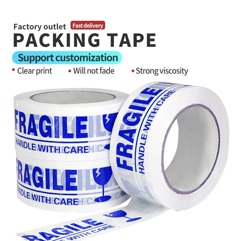 White packing tape roll with blue 'FRAGILE' and handle-with-care text