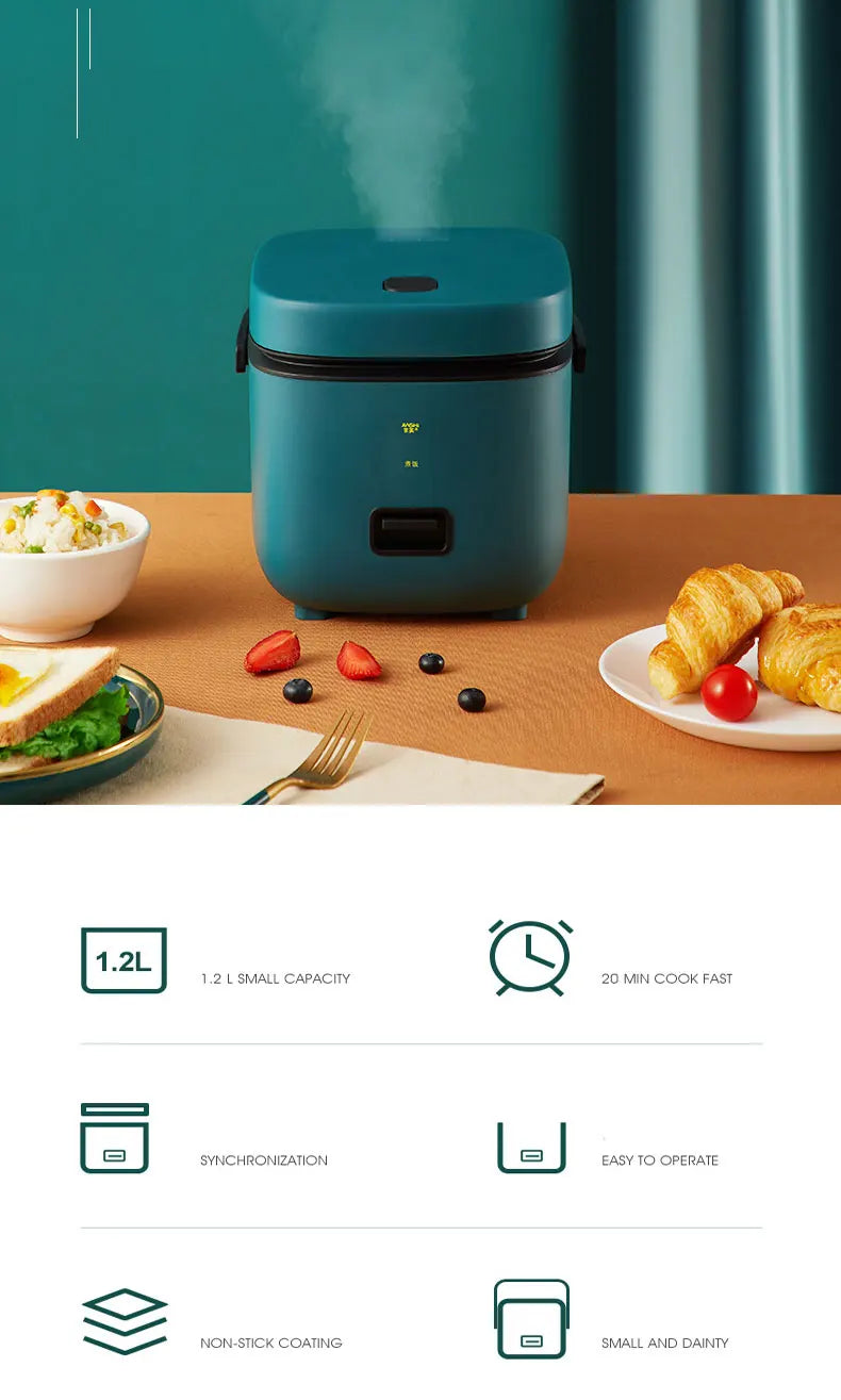 Mini electric rice cooker teal body on table, compact 1.2L design with control panel.