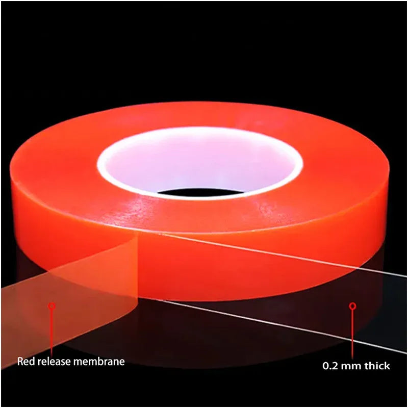 Red double-sided tape roll with white release liner on top