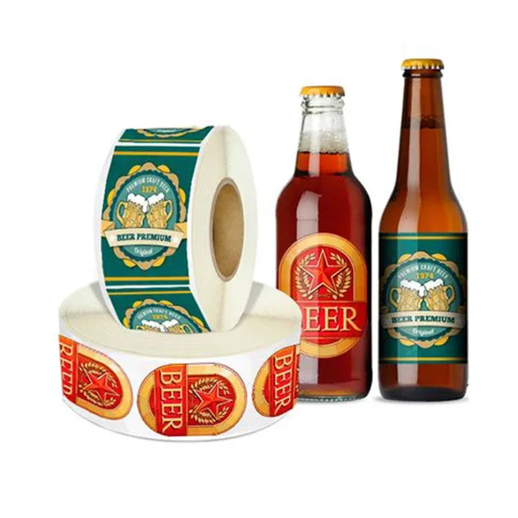 Printed sticker label roll with beer-style logo designs, shown beside bottles