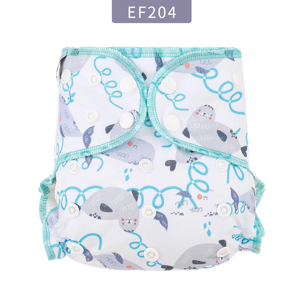 Reusable cloth baby diaper with cute seal print and adjustable snap buttons. White diaper with teal trim.