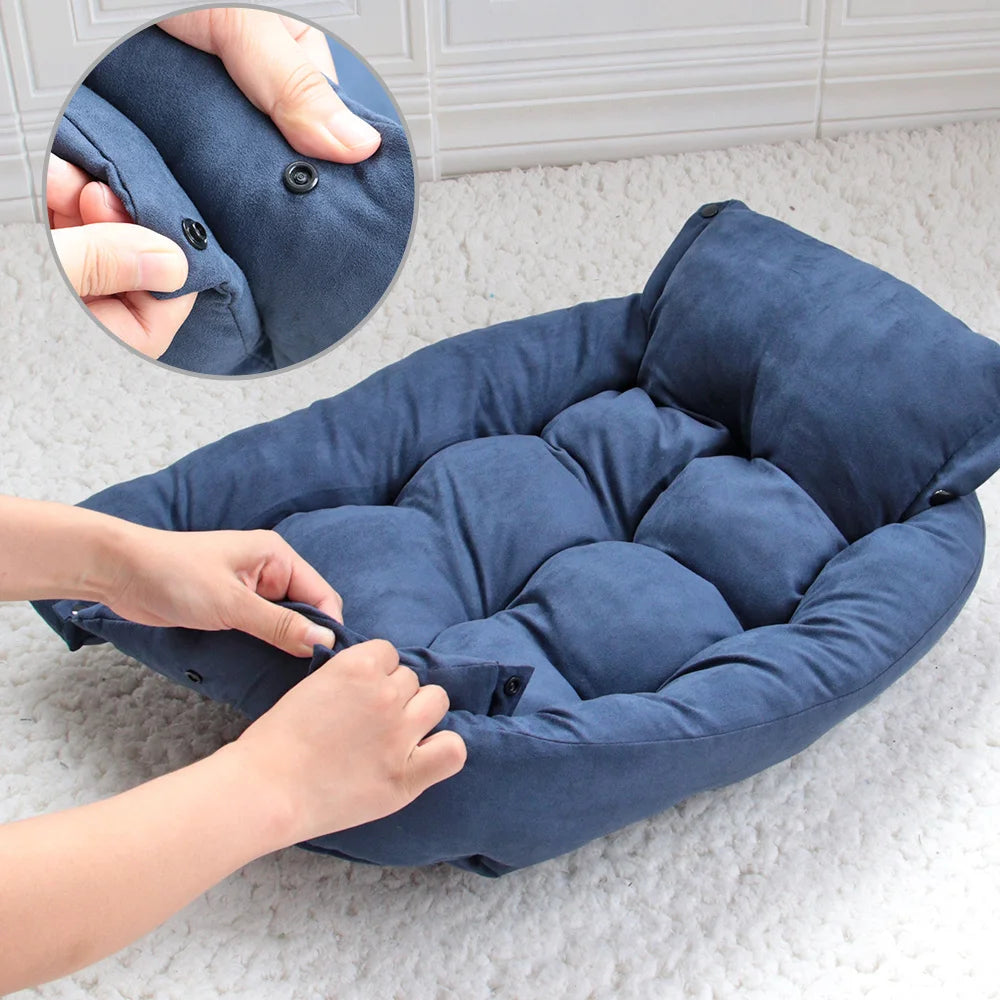 Plush blue dog sofa bed with snap-button sides for cozy winter warmth. A comfortable, soft mattress for pets.