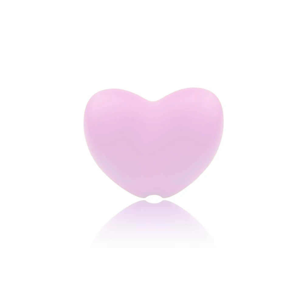 Pink heart-shaped silicone baby teething toy for soothing sore gums.