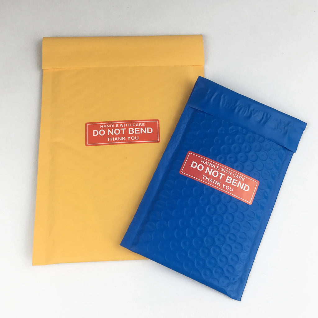 Yellow envelope and blue padded mailer, both with red “Do not bend” warning stickers