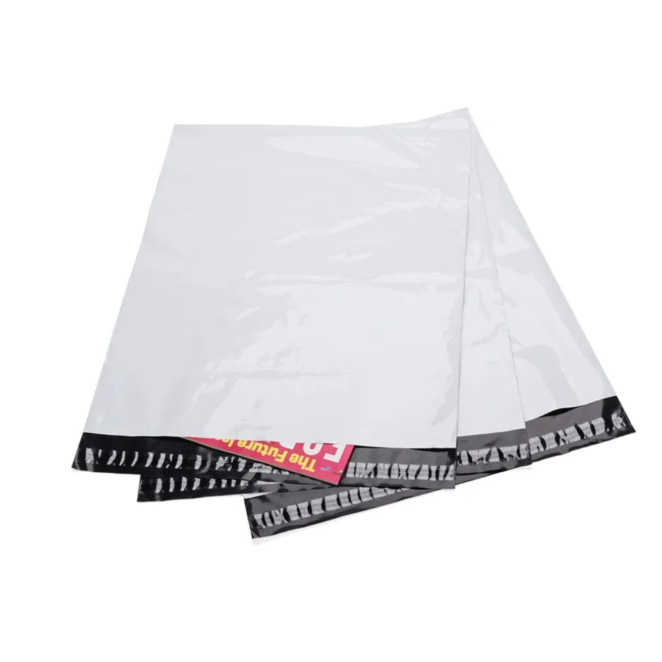 White poly mailer envelope-style shipping bag, overlapping layers with dark patterned edge