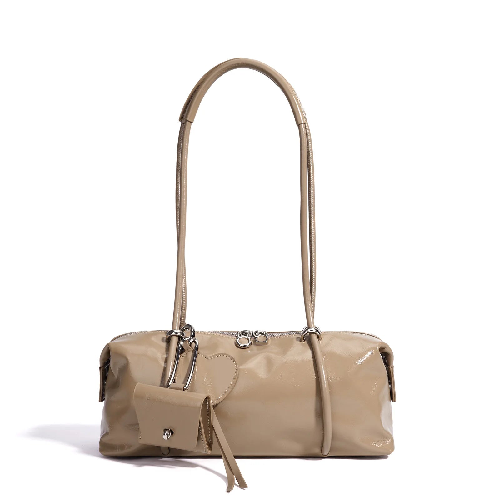 Beige glossy minimalist Boston shoulder bag with zipper closure, luxe texture, and heart-shaped pendant accessory.