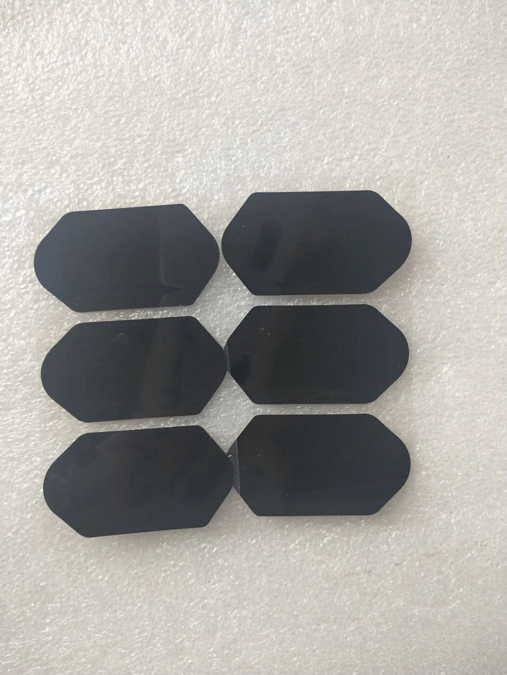Set of six black replacement film stickers for 3D 4D HIFU beauty machine cartridges on a textured white background.