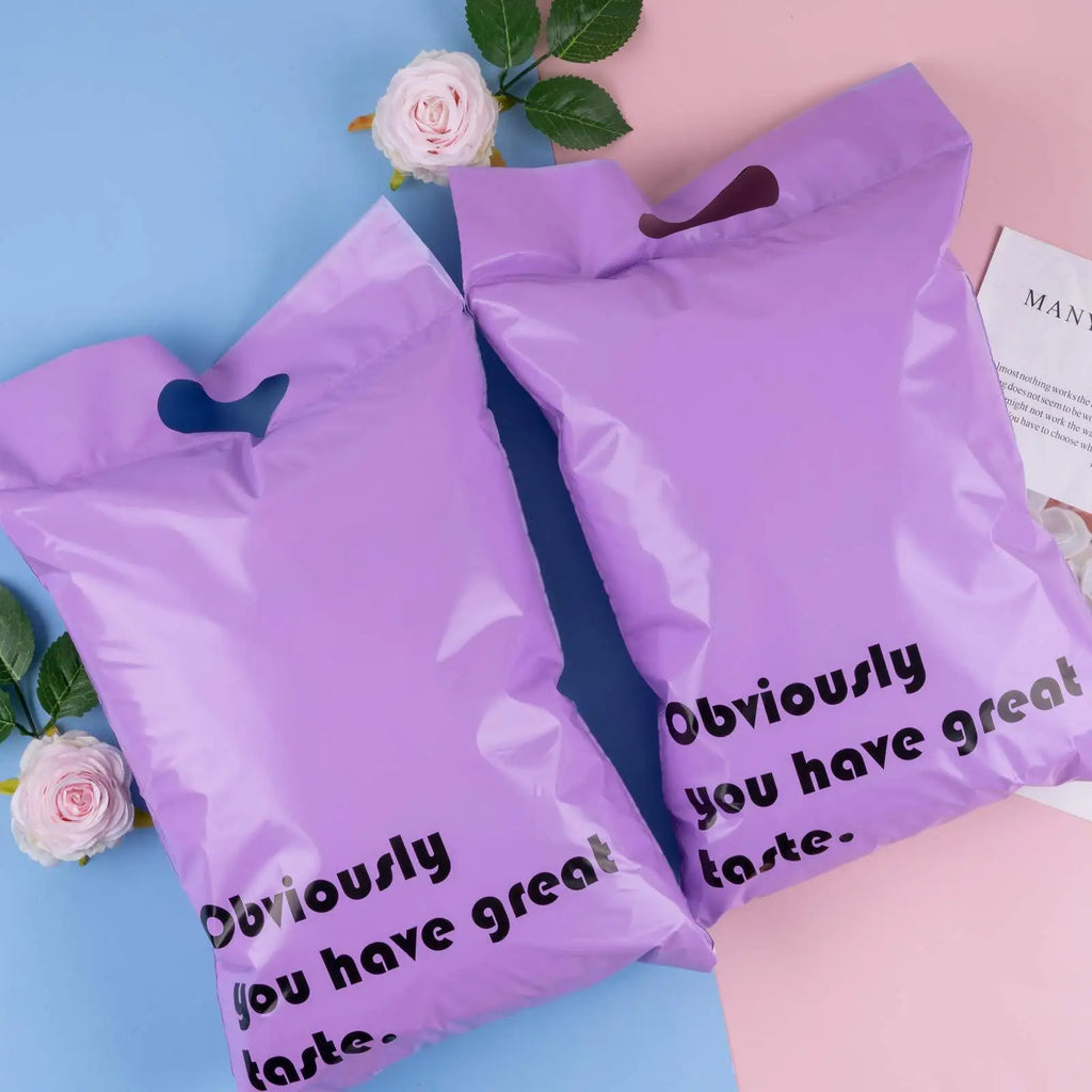 Lavender poly mailer bags with top handle cutouts, “Obviously you have great taste” printed.
