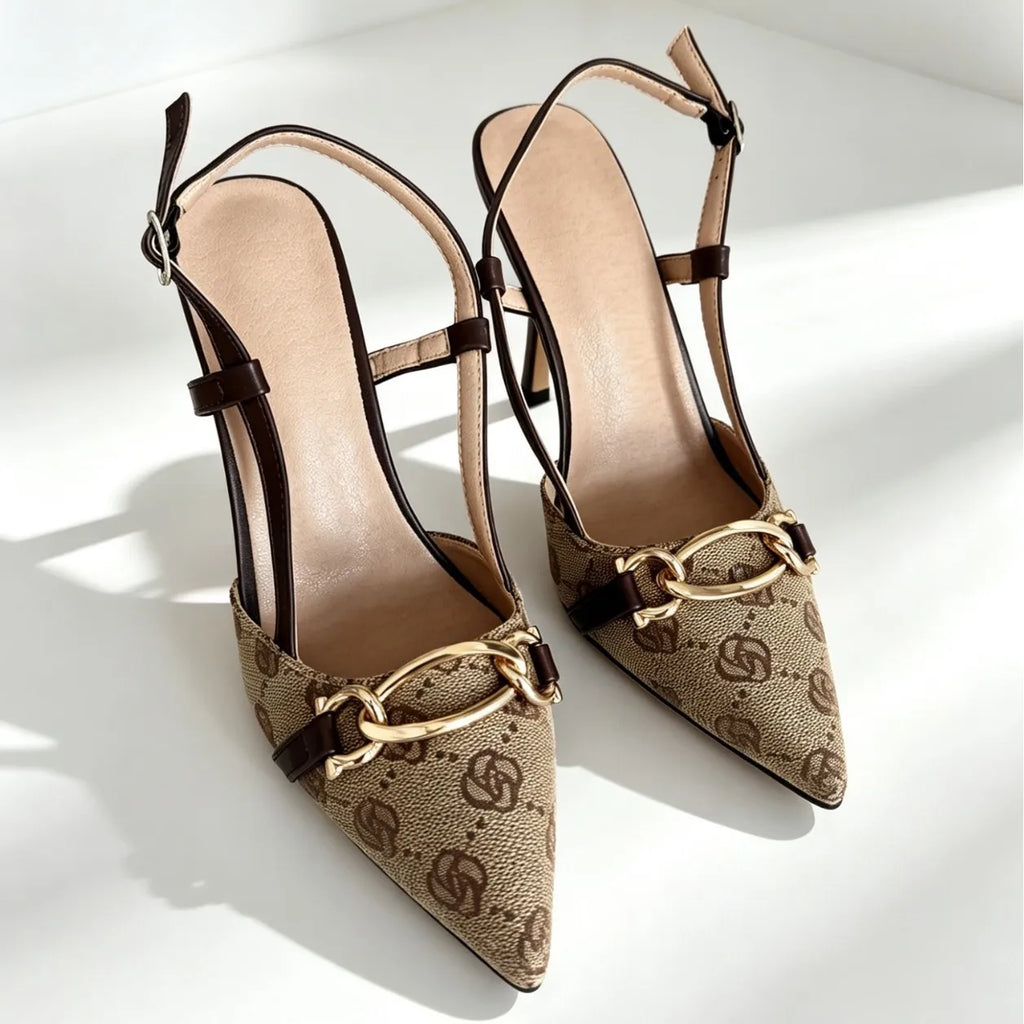 This Fashionable Sandal Features a  Rhinestone Bow Design. It Has a Unique, Slender Heel Style and Is Versatile