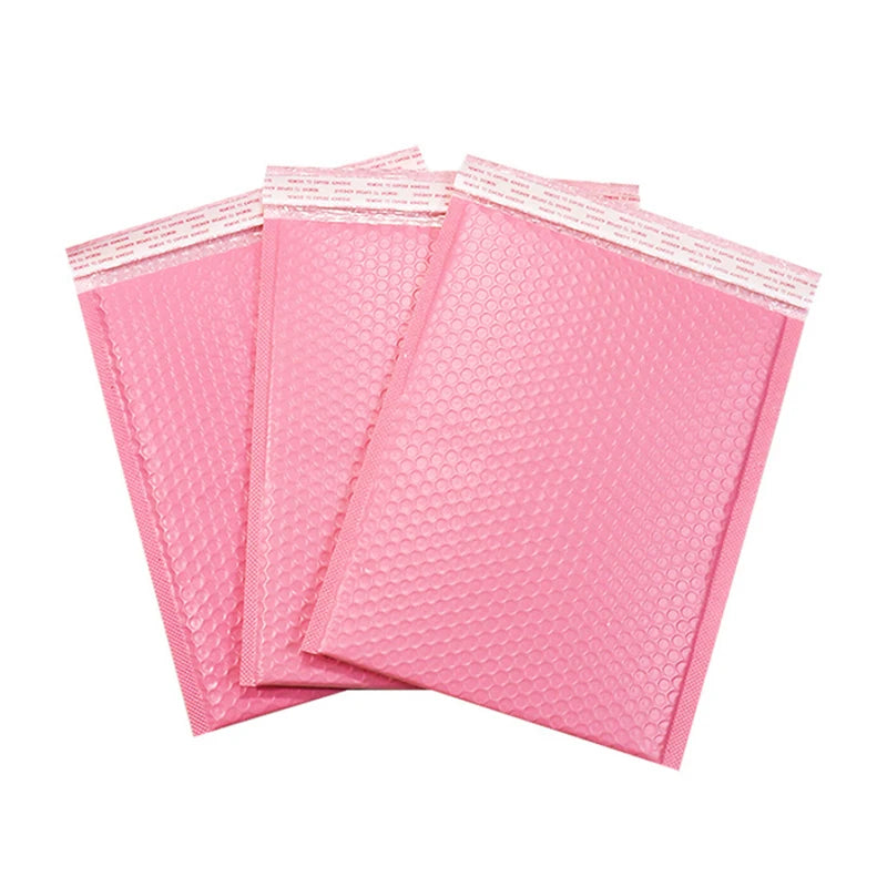 Light pink bubble mailers, stacked waterproof padded shipping bags