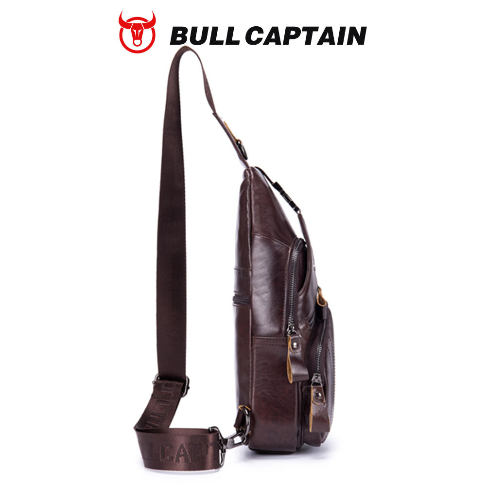 BULLCAPTAIN dark brown genuine leather men’s crossbody sling bag with vintage trunk-style design and striped strap.