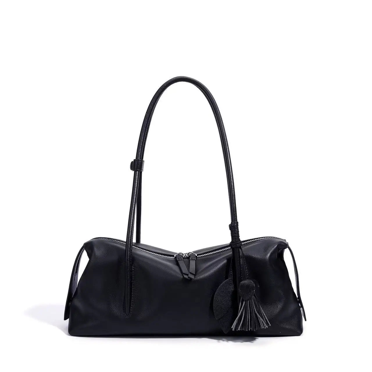 Black genuine cowhide leather trunk shoulder bag with zipper closure, adjustable strap, and decorative tassel detail.