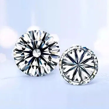 Pair of round brilliant-cut cubic zirconia gemstones, white, detailed faceted surfaces