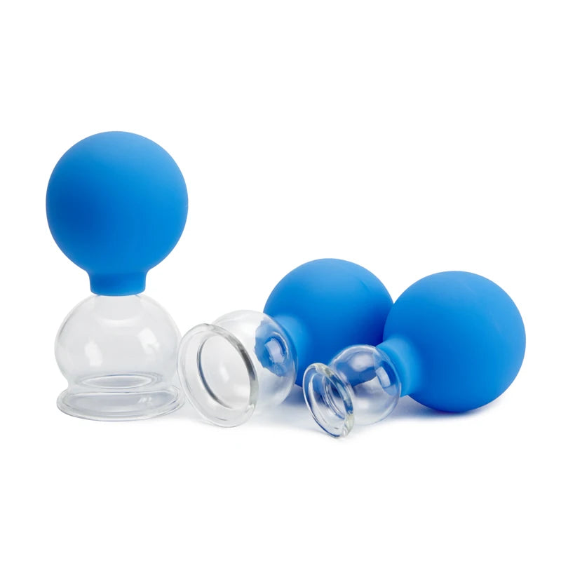Three cupping therapy jars with clear glass cups and bright blue silicone squeeze bulbs on a white background.