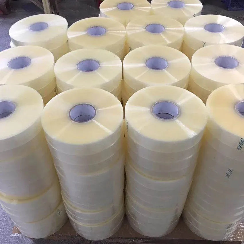Stack of pale yellow packing tape rolls with visible blue center core