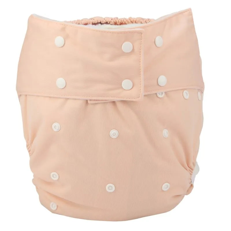 Reusable baby cloth diaper in solid peach with adjustable white snap buttons. Eco-friendly baby care essential.