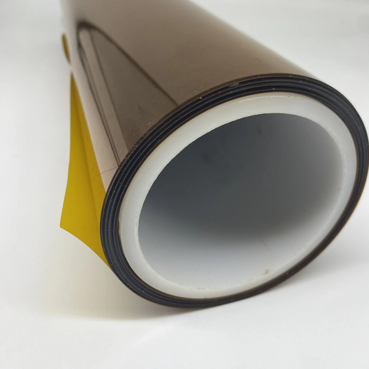 PI stretch film roll end view with white liner and dark rim, with yellow edge