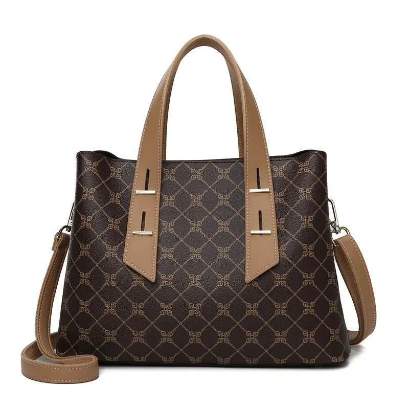 KALANTA brown monogram designer handbag with tan leather handles, adjustable shoulder strap, and elegant gold hardware.