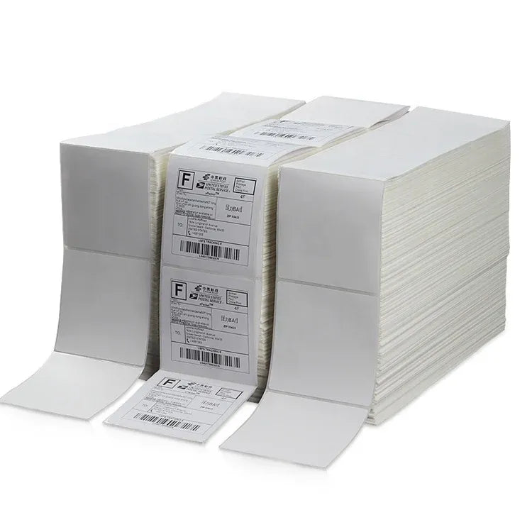 White thermal shipping label fanfold stack with barcoded labels and backing sheets