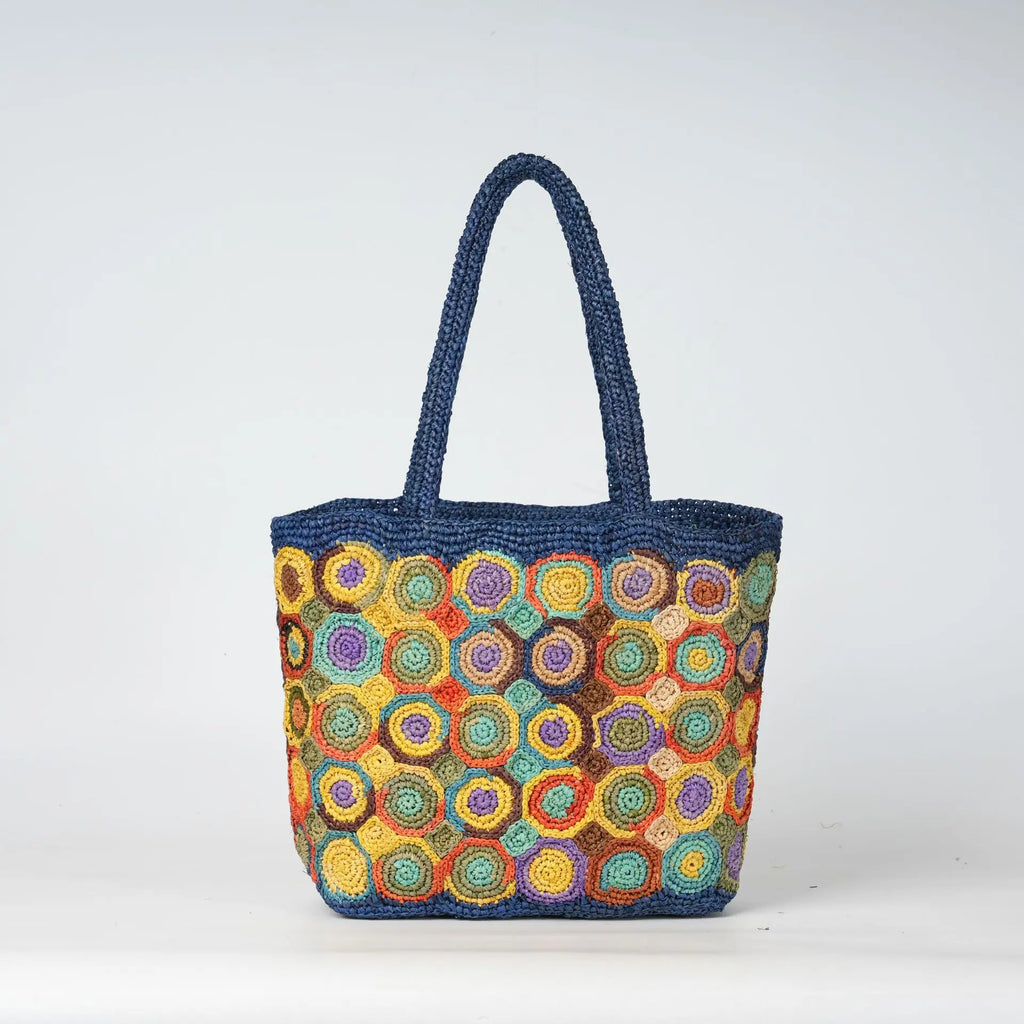 Blue woven crochet tote bag with colorful circular patterns, perfect for a durable summer beach handbag.