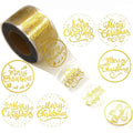 Roll of round Merry Christmas stickers with gold text and border, transparent adhesive finish.