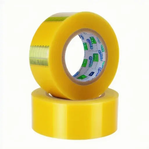 Yellow packaging tape roll stacked on another roll, showing printed tape backing inside
