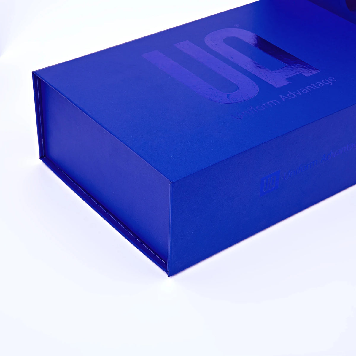 Blue corrugated mailer box with custom logo on top, side profile view.