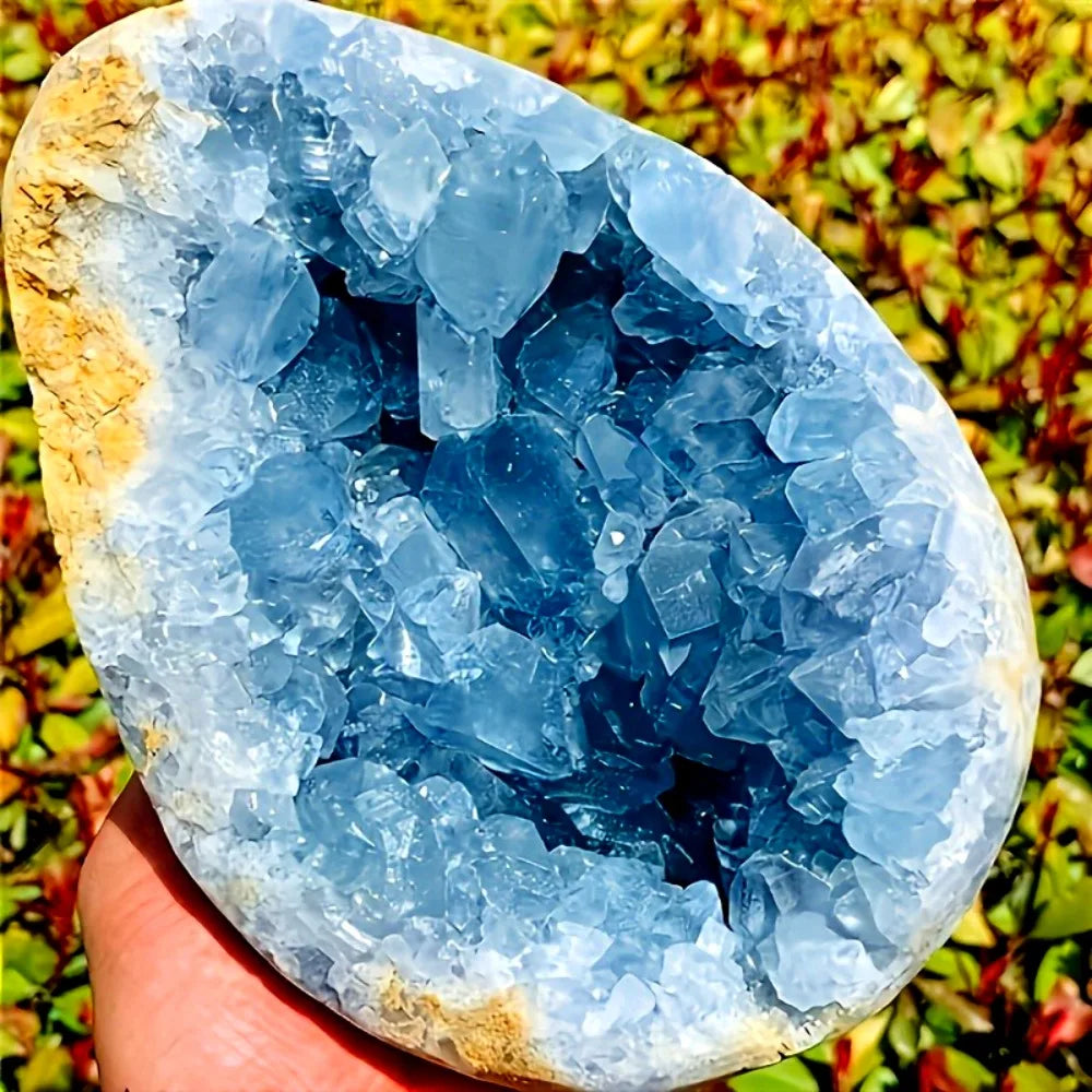 Blue celestite geode cluster in egg-shaped slice with jagged crystal points