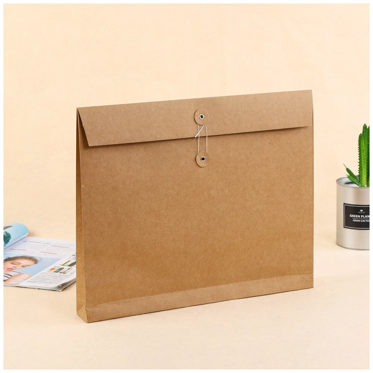Brown kraft paper expandable mailer with two eyelet closure on flap
