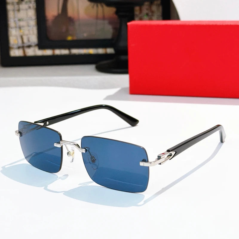 Rimless rectangular sunglasses, silver metal frame, black acetate temples, and blue tinted lenses for luxury eyewear.