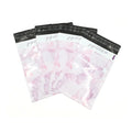 Pink translucent printed poly mailer bag with black header and joyfulPAK logo