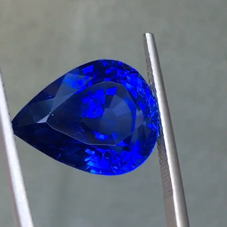Royal blue pear-cut sapphire loose stone with blue facets