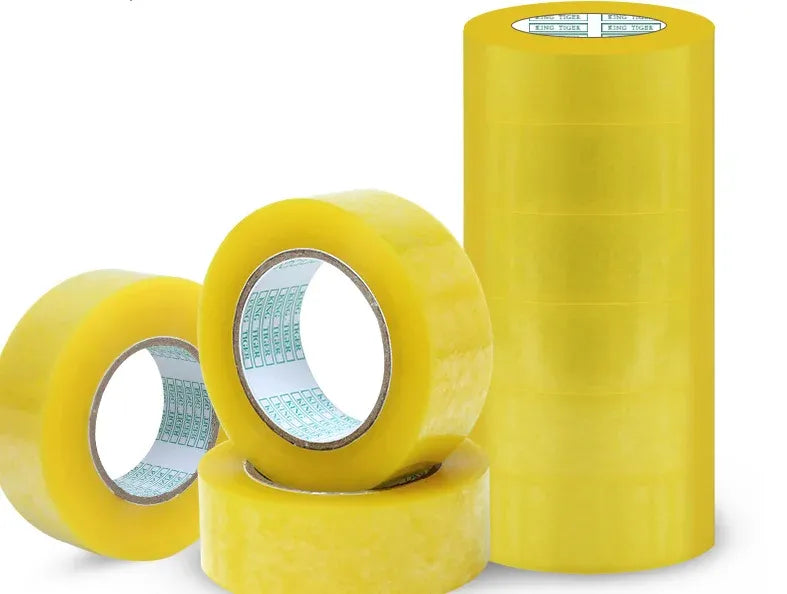 Set of yellow packaging sealing tape rolls with silver core rings
