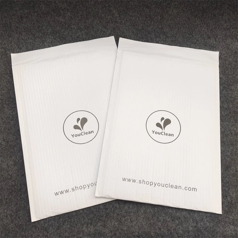 White padded shipping mailer bags with YouClean logo and www.shopyouclean.com