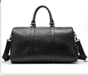 Black genuine leather designer shoulder tote bag with top handles, structured silhouette, and detachable crossbody strap.