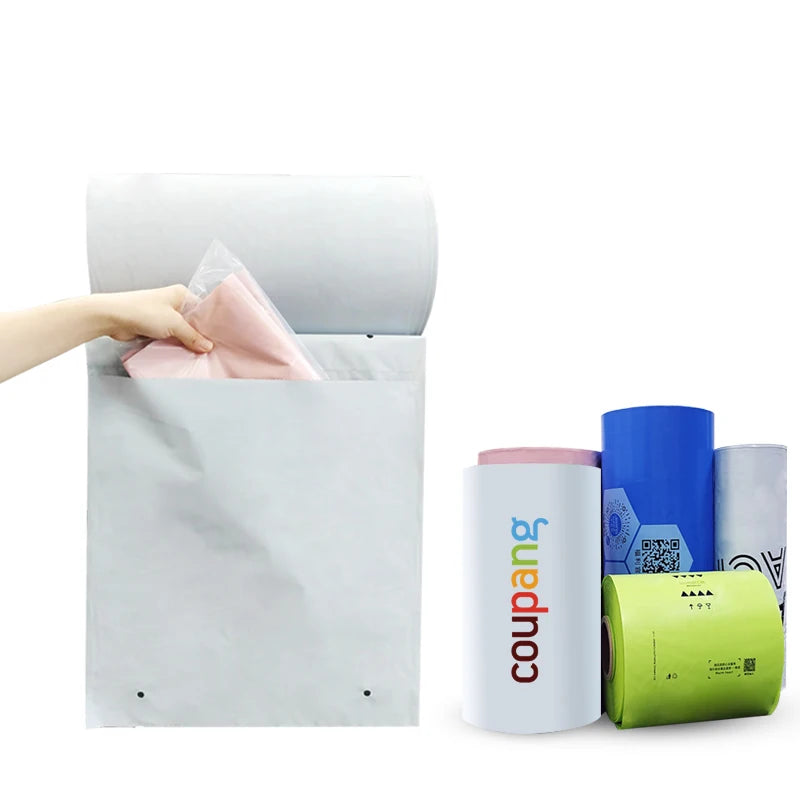 White pre-opened courier bags with pink and blue rolls beside them