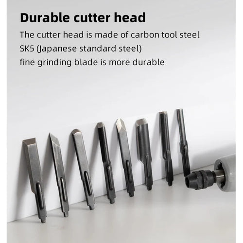 Row of metal carving chisel bits with pointed tips for woodworking tools