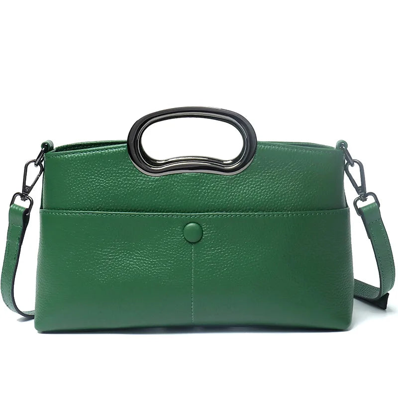 Green pebble-textured PU leather designer handbag with a unique oval metal top handle and detachable shoulder strap.