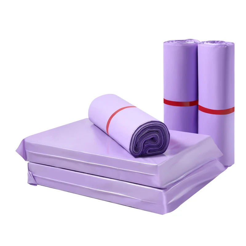Purple poly mailer sheets and rolled bundles tied with red bands