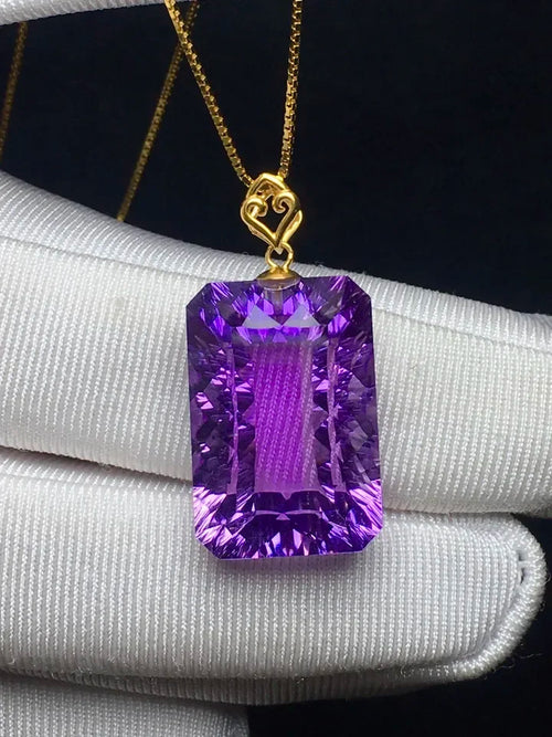 Purple amethyst pendant necklace with gold chain and large rectangular gemstone