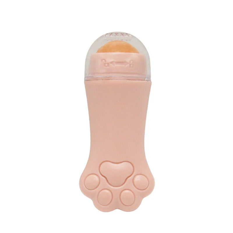 A light pink, cat-paw shaped facial oil-absorbing roller with a volcanic stone tip under a clear protective cap.
