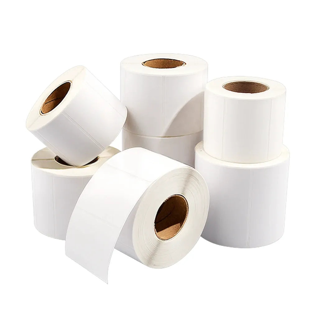 White rolls of adhesive label stickers with visible cardboard cores