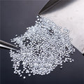 Loose round brilliant lab-grown diamonds, glittering micro stones in a pile