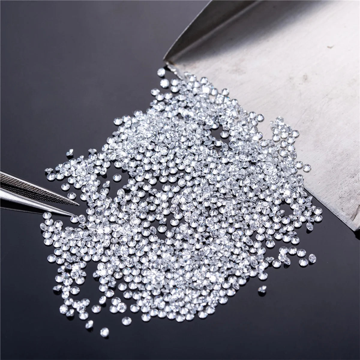 Loose round brilliant lab-grown diamonds, glittering micro stones in a pile