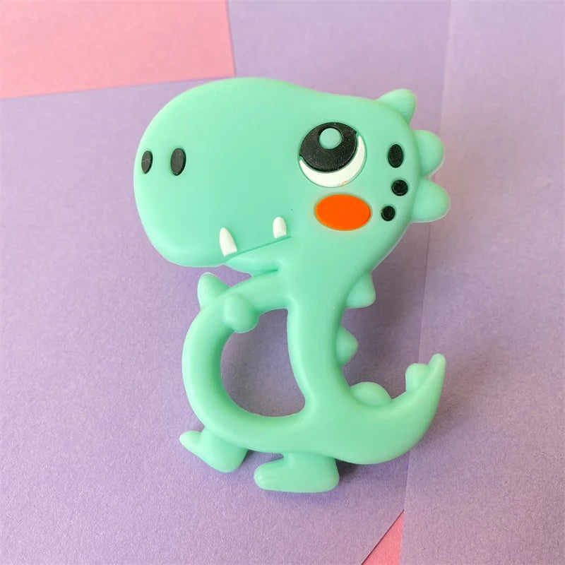 Light green silicone dinosaur teething toy for baby teething relief.